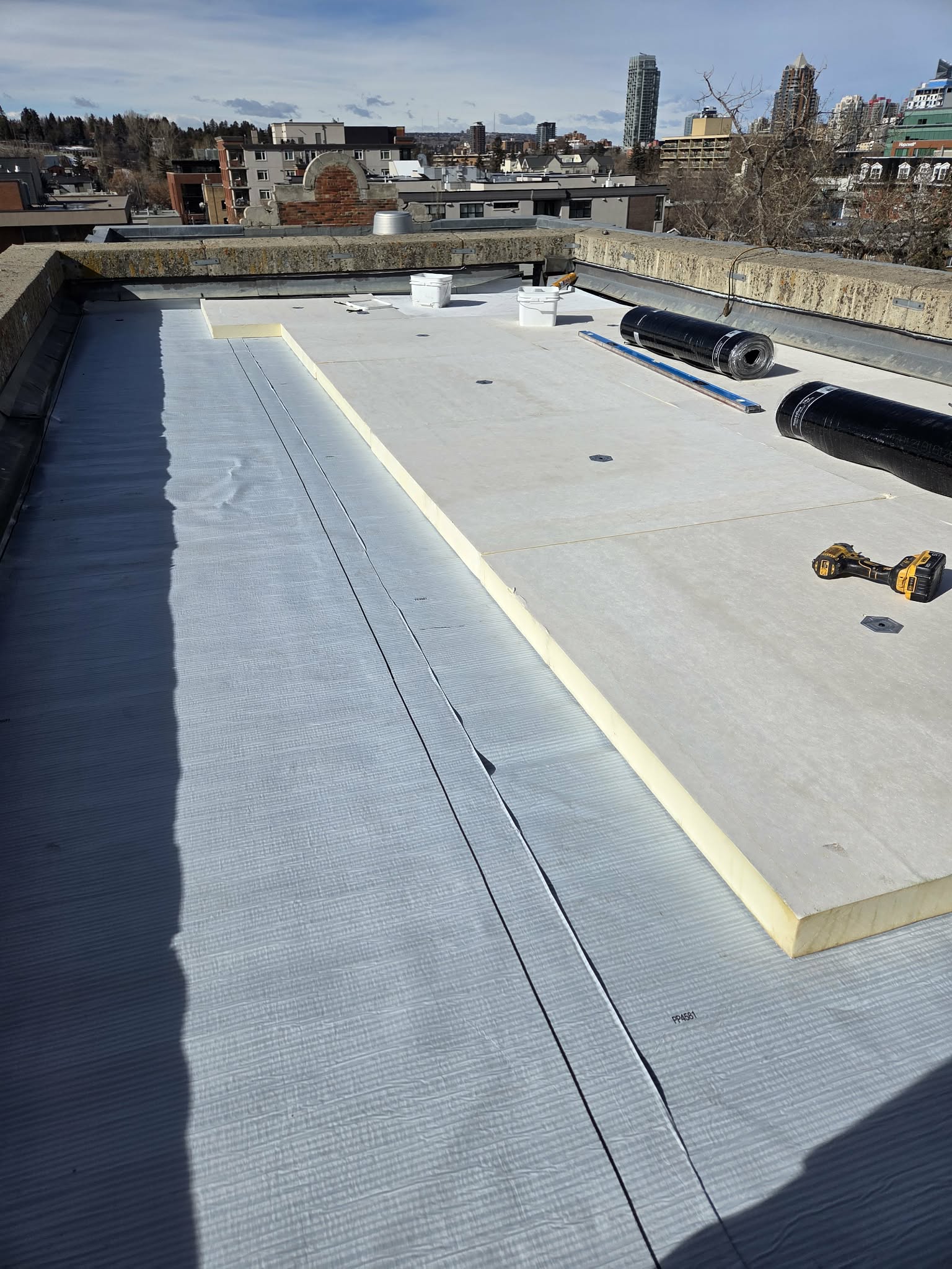 Detailed roofing repair and maintenance on a commercial building